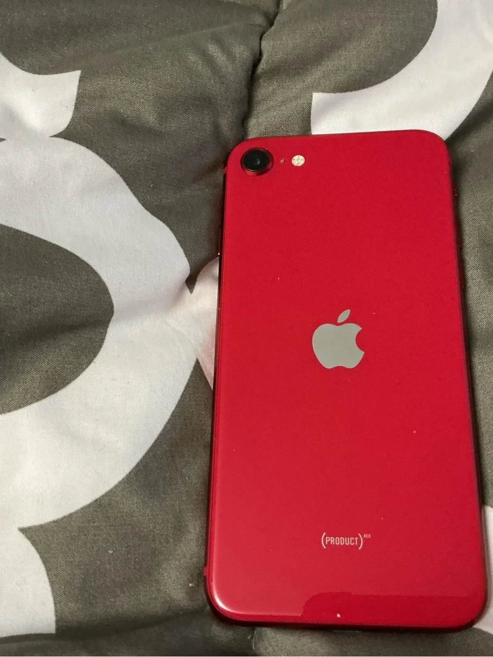 Apple iPhone with Red Case and Black Front